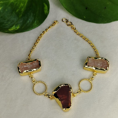 Golden bracelet with natural stones beads on a light background