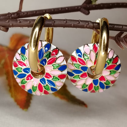 Colorful Enamel earrings with golden Hoops on a Branch