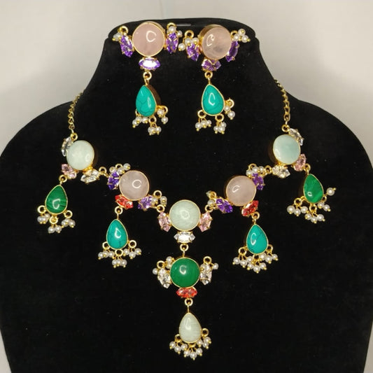 Natural gemstones Jewelry set with on a black stand against a white background