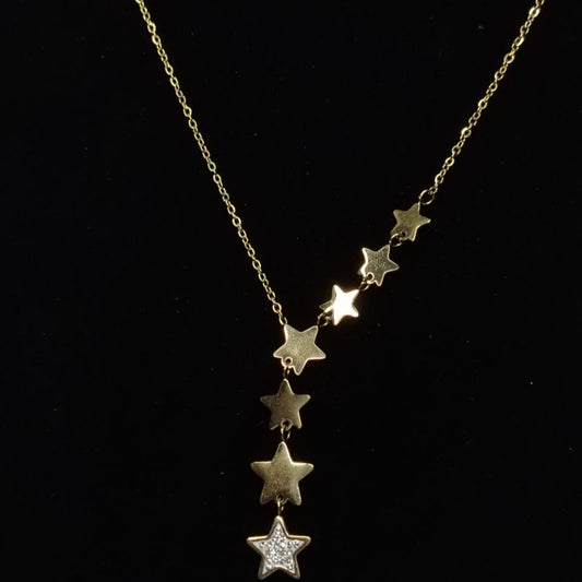 Golden anti-tarnish necklace with star-shaped pendants on a black background