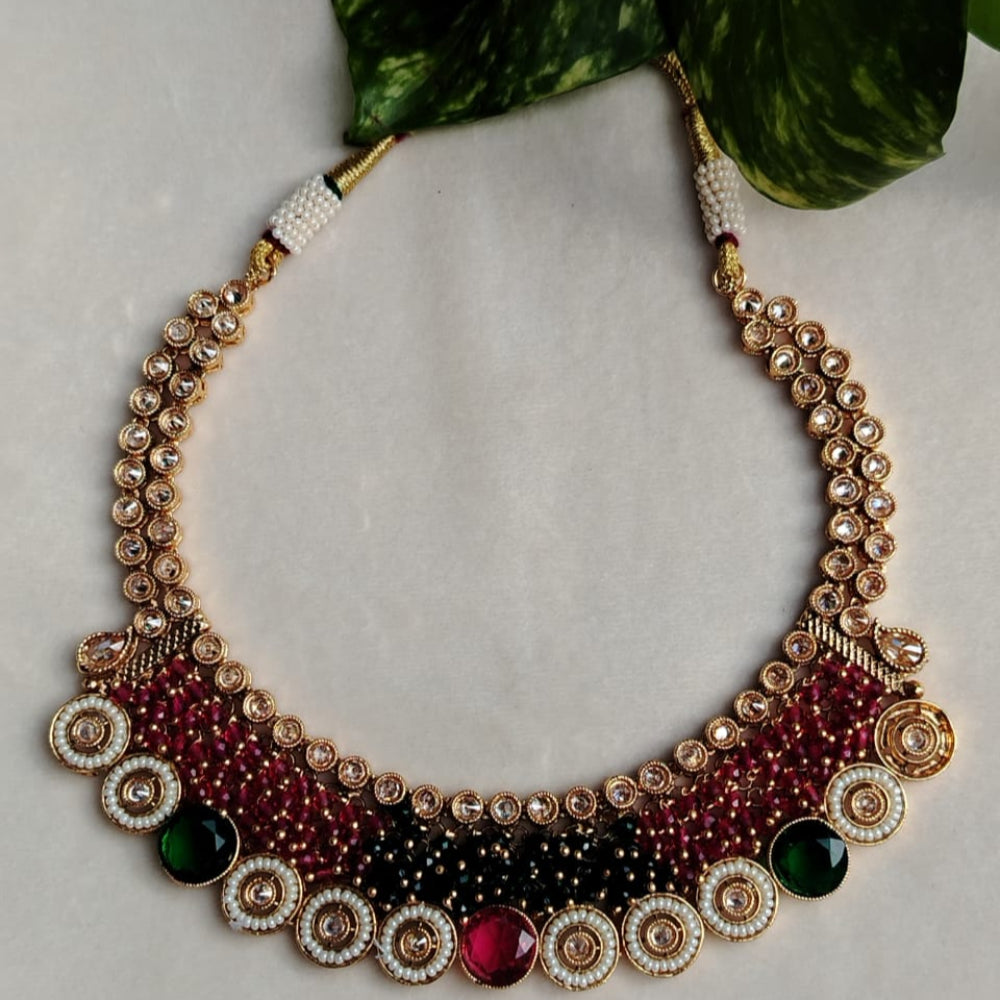 Elegant beaded necklace with gemstones on a light background