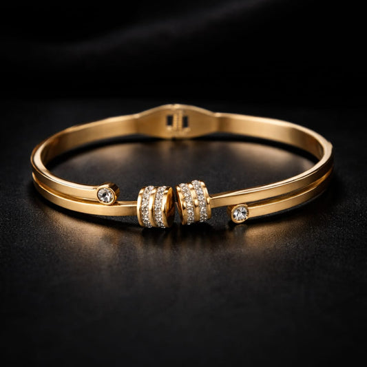 Golden Bracelet with Embedded CZ Stones on a Dark Background